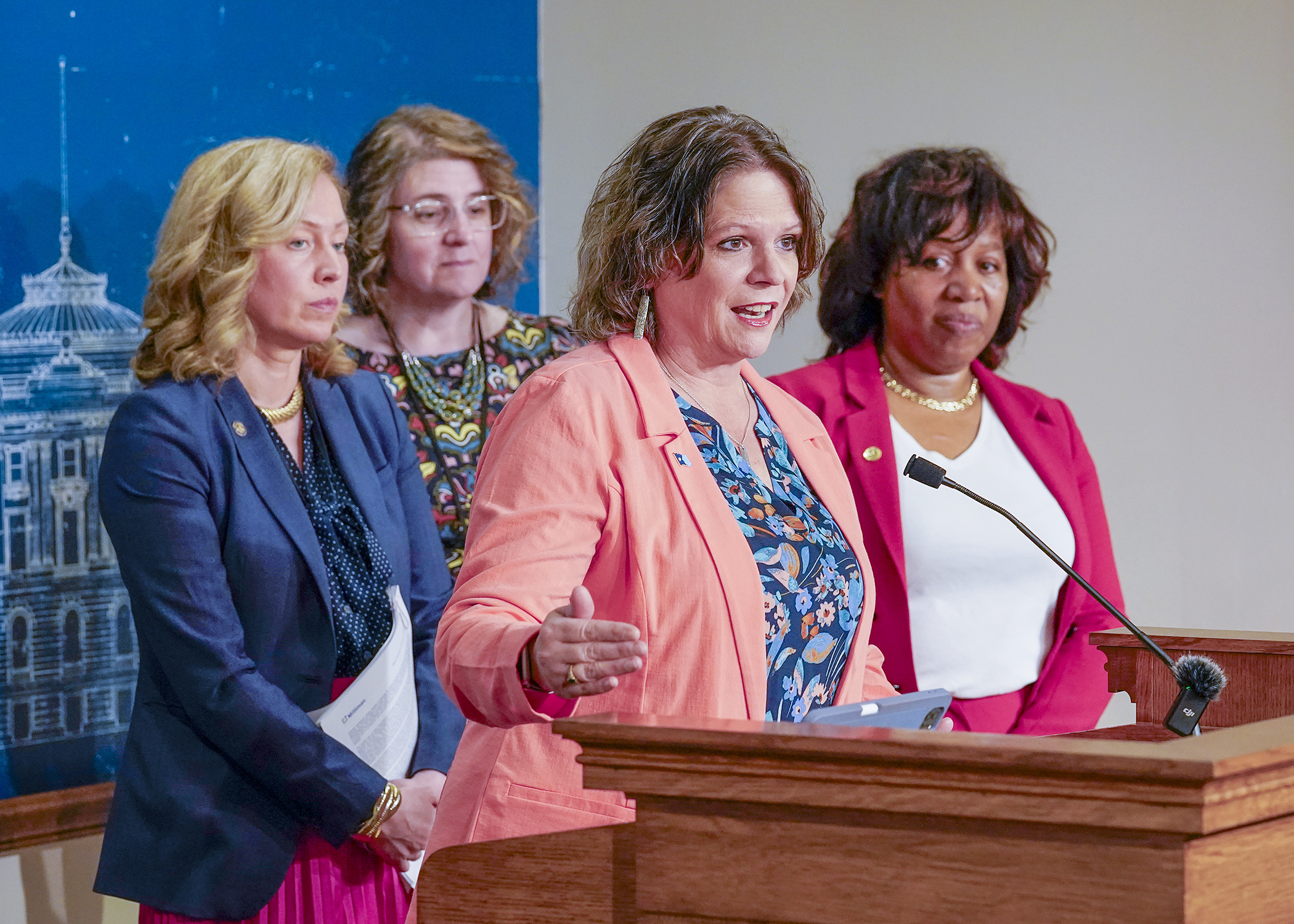 Flanked by Rep. Heather Edelson, Rep. Bianca Virnig and Rep. Mary Frances Clardy, Rep. Cheryl Youakim discusses HF5237, the K-12 education supplemental budget bill. Youakim, the House Education Finance Committee chair, sponsors the bill up or a floor vote Tuesday. (Photo by Andrew VonBank)